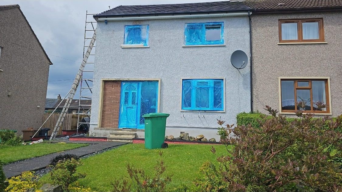 Windows masked and prepped before wall coating